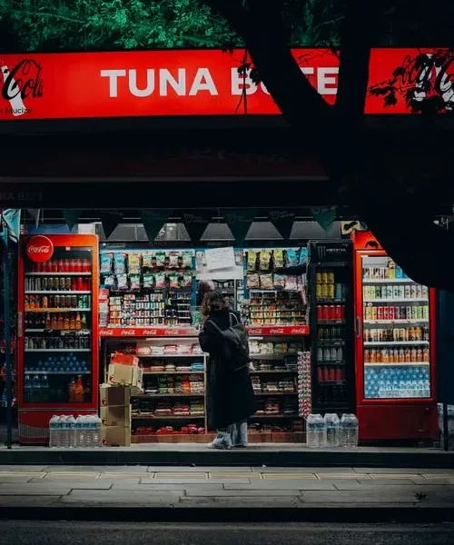 A convenience store front lit up at night